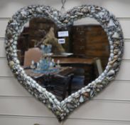 A heart-shaped shell mirror W.60cm x H.58cm