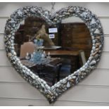 A heart-shaped shell mirror W.60cm x H.58cm