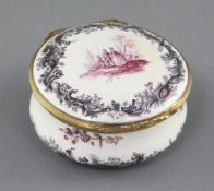 A German tin glaze circular snuff box, 18th century, the cover painted with the scene of figures and