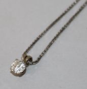 A white metal and solitaire diamond pendant, on an 18ct white gold fine link chain.