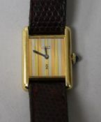A lady's silver gilt Must de Cartier manual wind wrist watch.