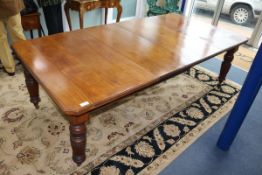 A Victorian mahogany extending dining table with two leaves W.238cm