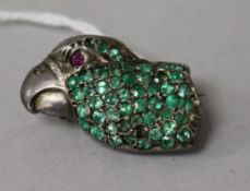 A white metal, gem set and enamel brooch, modelled as the head of a parrot, 29mm.
