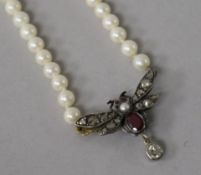 A Victorian white and yellow metal, rose cut diamond, ruby and split pearl set bug pendant, now