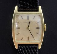 A lady's 18ct gold International Watch Co manual wind wrist watch, with tonneau shaped case and