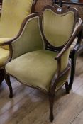 A late Victorian inlaid mahogany armchair, with shaped back