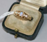 An early 20th century 18ct gold, white opal and diamond half hoop ring, size K.