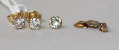 A pair of yellow metal and solitaire diamond ear studs, three 9ct gold butterflies and a 9ct gold