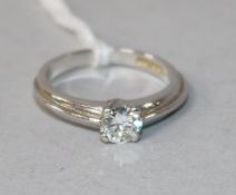 A modern 18ct white gold and claw set solitaire diamond ring, size L.