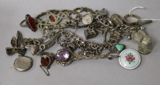 A small group of silver and marcasite jewellery including two charm bracelets and a Norwegian enamel