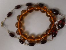 Two simulated amber bracelets.