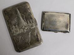 An embossed white metal cigarette case, with presentation inscription, Bangkok 1946 and an engine-