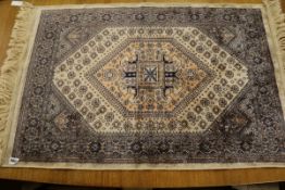 A small part-silk rug 100 x 68cm