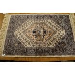 A small part-silk rug 100 x 68cm