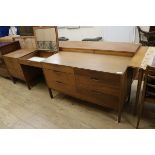 A 1950's Modular teak dressing table W.249cm