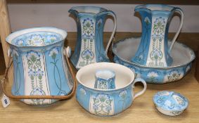 Ford & Sons, Crownford, Burslem, an eight-piece toilet set decorated with stylised cornflowers