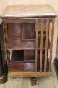 An Edwardian inlaid mahogany revolving book case W.48cm