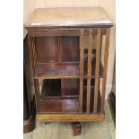 An Edwardian inlaid mahogany revolving book case W.48cm