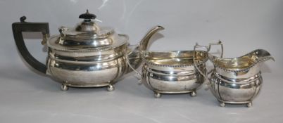 A George V silver three piece tea set, Harrods Ltd, London, 1929, gross, 30.5 oz.