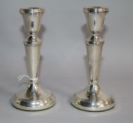 A pair of modern silver candlesticks, by P&S, London, 1990, height 14.5cm, weighted.