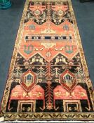A Baluchi rug 245 x 110cm