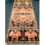 A Baluchi rug 245 x 110cm