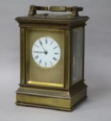 A French silvered brass carriage clock, having hour-repeat movement with circular enamelled Roman