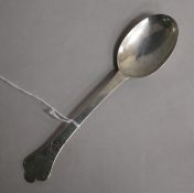 A late 17th century silver lace-back trefid spoon, the terminal chased with scrollwork, scratched