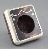 A George V silver and tortoiseshell pique mounted travelling watch case by Charles & Richard Comyns,