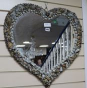 A heart-shaped shell mirror W.60cm x H.58cm
