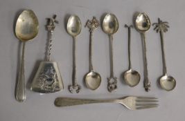 A Continental silver caddy spoon and eight other items.