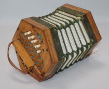 A 21-button Concertina Superior, possibly German, with fret-cut ends (faults, no case)