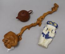 A Chinese wood ruyi sceptre, a Yixing teapot and a ceramic wall pocket ruyi sceptre length 47cm