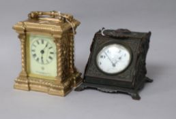 A gold-plated pocket watch in cast brass enclosed watch stand and an Ansonia Clock Co. gilt metal