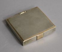 A 1930's Art Deco parcel gilt silver compact/cigarette case, retailed by Asprey, London, maker