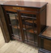 An inlaid mahogany bookcase W.92cm