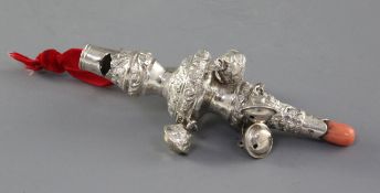 A William IV embossed silver child's rattle with coral teether, by Unite & Hilliard, hung with six