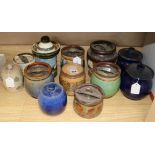 Twelve Doulton tobacco jars and covers, various designs