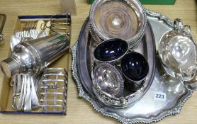 An Old Sheffield plate wine funnel, a pair of plated salts, a Victorian plated wine coaster and