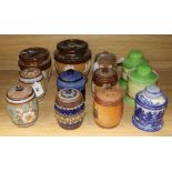 Twelve Doulton tobacco jars and covers, various designs