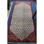 An Araak rug, 238 x 98cm