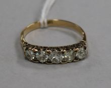 An 18ct gold and five stone diamond ring, size O.