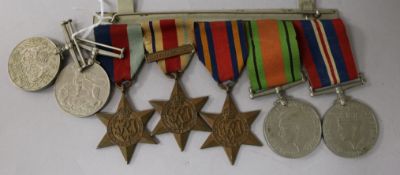 A group of WWII medals and two other medals