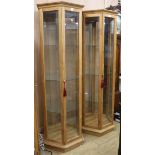 A pair of beech framed hexagonal display cabinets with four shelves W.72cm