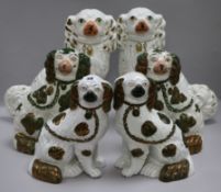 Three pairs of graduated Staffordshire pottery dogs tallest 33cm