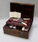 An early Victorian brass mounted rosewood toilet box with fitted plate, mounted interior width