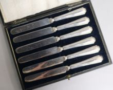 A cased set of six silver handled tea knives.