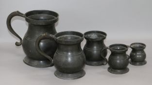 Five graduated pewter tankards, tallest 17cm