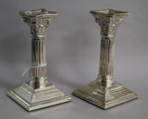 A pair of silver corinthian column candlesticks, Nat Leslie Ltd, Birmingham, 1965, 16.5cm,