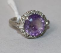 A 1920's/1930's 18ct gold and platinum, amethyst and diamond dress ring, size K.